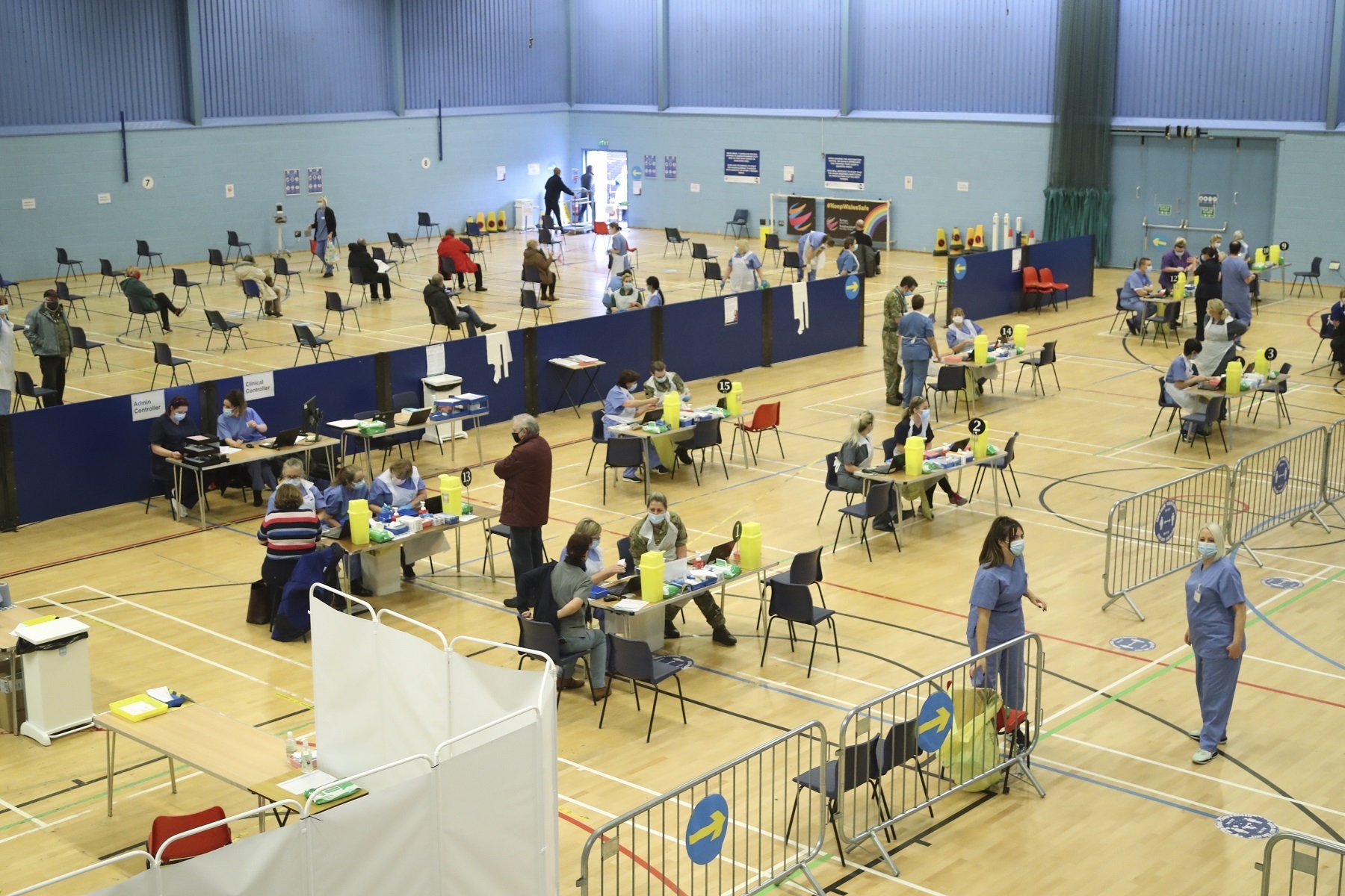 Members of the public receive a dose of the Oxford/AstraZeneca vaccine at a vaccination centre at Cwmbran Stadium in Cwmbran. Picture: PA Wire