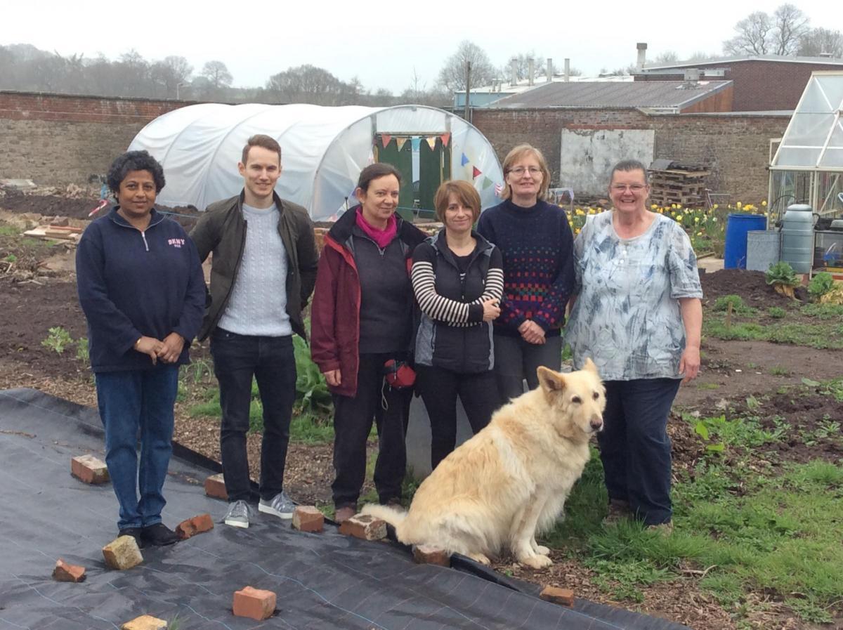 GARDEN VISION: Trustees of the Friends of Llanfrechfa Grange Walled Garden in 2018, from left - Umapathy Sundari, Chris Parsons, Jane Nehaul, Angela Fry, Binca Wilson and Jan Smith, with honorary trustee and four-legged friend Ben